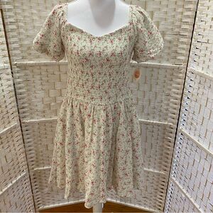 Tullabee cream dress with small pink floral pattern.